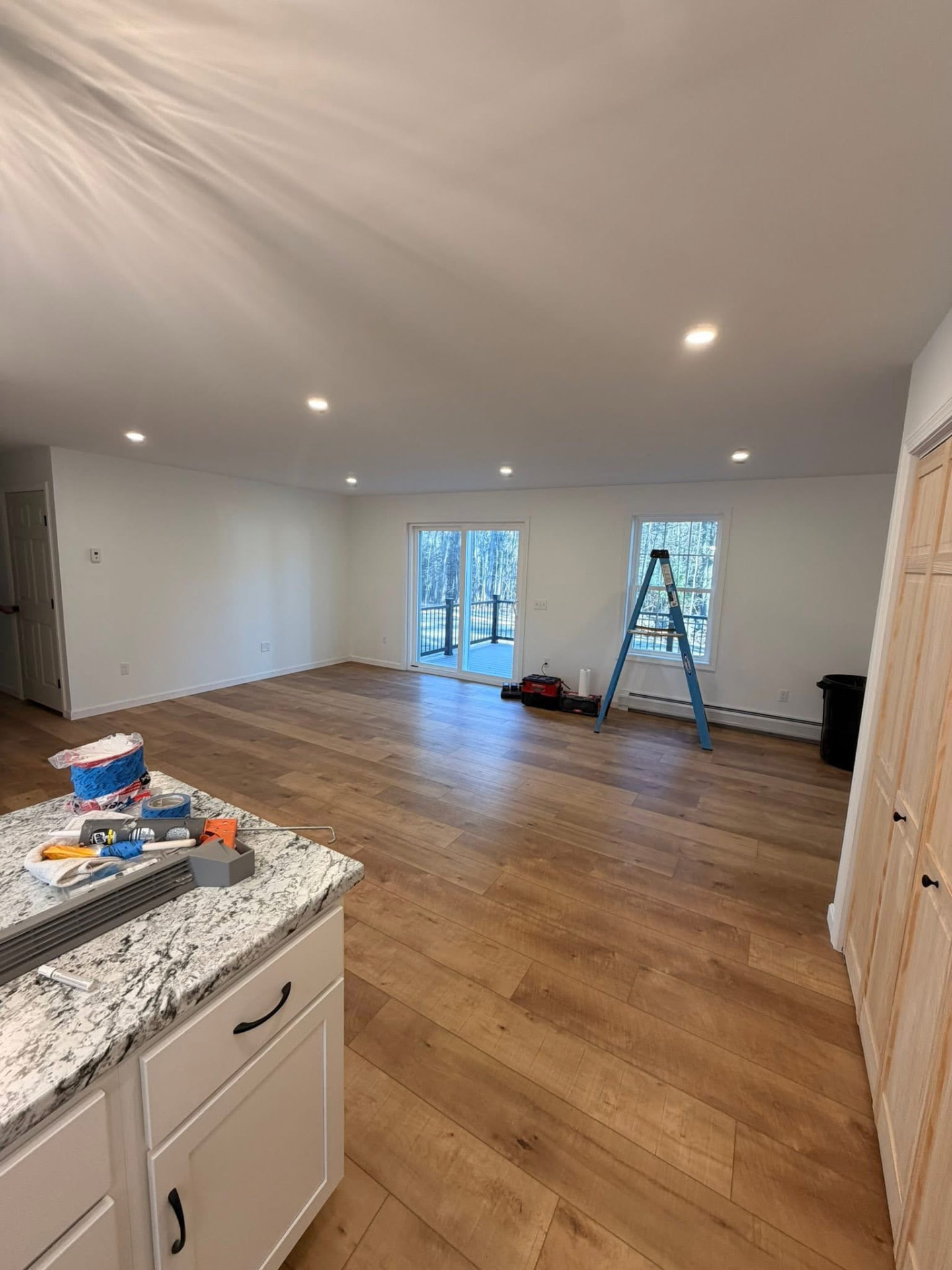 Open living area with new recessed lighting after a remodel